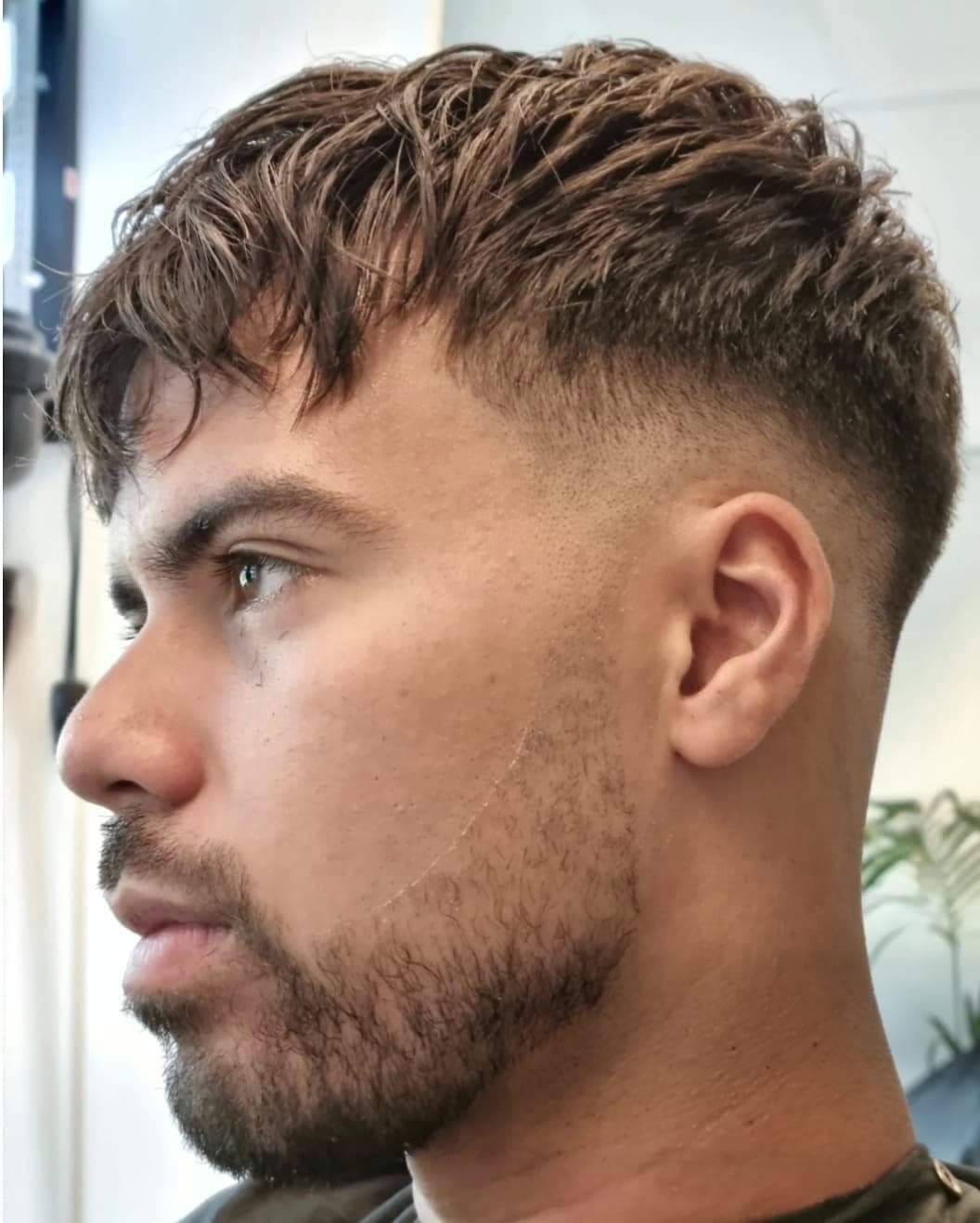 Textured crop with a high fade and beard