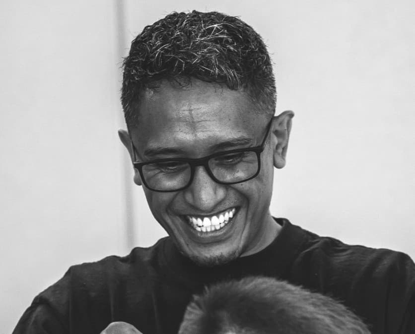 Marvin laughing while cutting hair